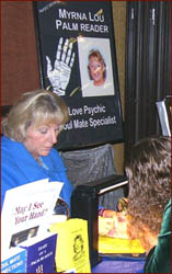 Palm reader Myrna Lou Goldbaum hosts a palm reading event.