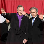 Former US president George H.W. Bush and his son George W. Bush: waving hands.