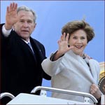 Former US president George W. Bush & his wife Laura Bush: waving hands.