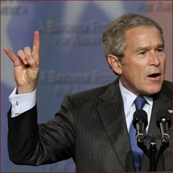 Former US president George W Bush: hook em horns hand gesture photo.