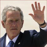 Former US president George W. Bush: left hand wave.