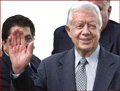 Former US president Jimmy Carter: right hand waving.