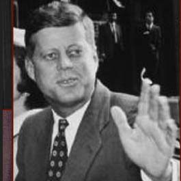 Former US president John F. Kennedy: left hand waving.