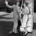 Former US president John F. Kennedy: right hand waving.