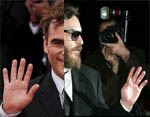 Joaquin Phoenix's hands.