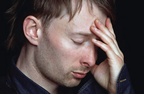 The left hand of Thom Yorke: short fingernails.